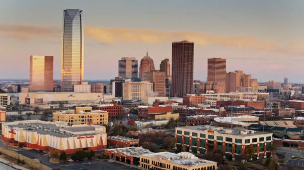 Panoramic cityscape view of downtown Oklahoma City during late autumn, illustrating the ideal seasonal window to complete residential winterization maintenance before sub-zero temperatures hit.