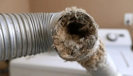 blocked plumbing vent pipe showing debris buildup causing bad drain smells.
