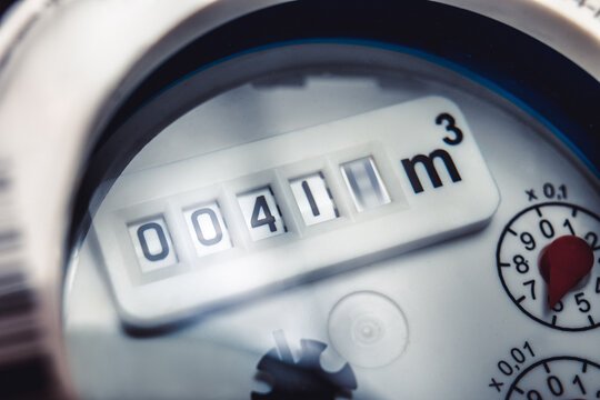 Digital water meter dial showing cubic meters readout.