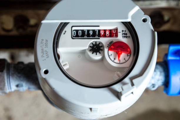 Analog water meter register displaying digits for utility billing.