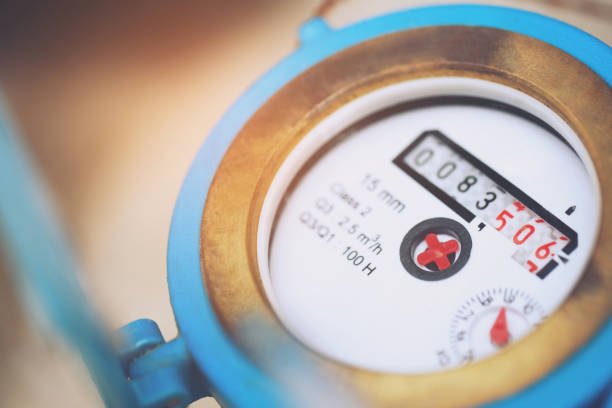 Blue mechanical water meter dial with numerical consumption counter.